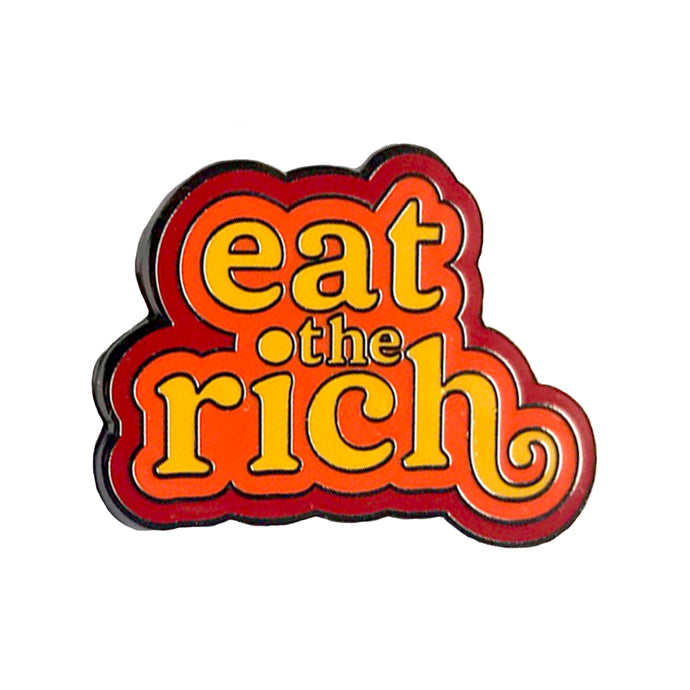 An enamel pin that reads 